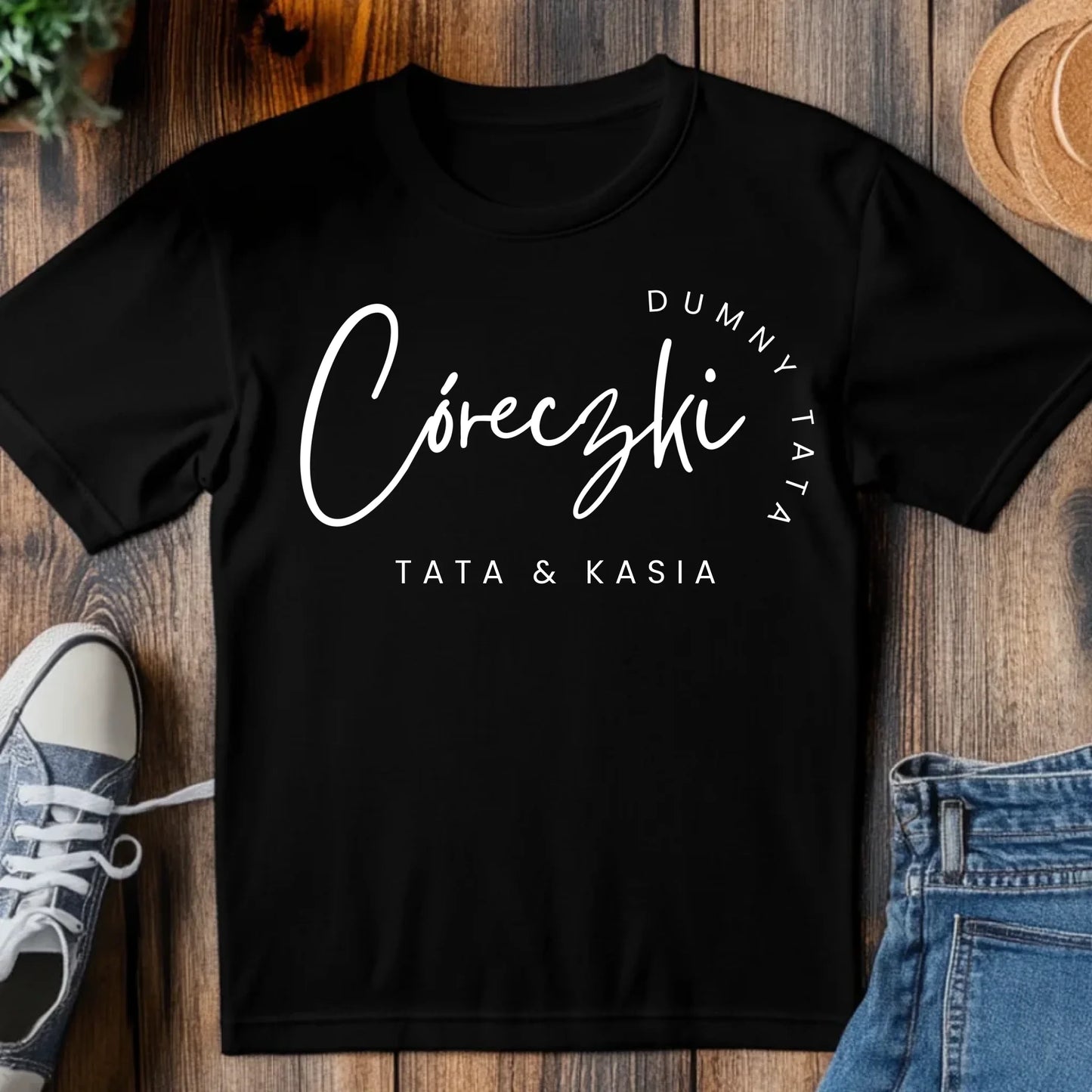 tj_tam_a_black_t-shirt_mockup_on_a_wood_table_with_a_pair_of_sn_6b5f746f-675d-4c35-ad43-c9b394cca209