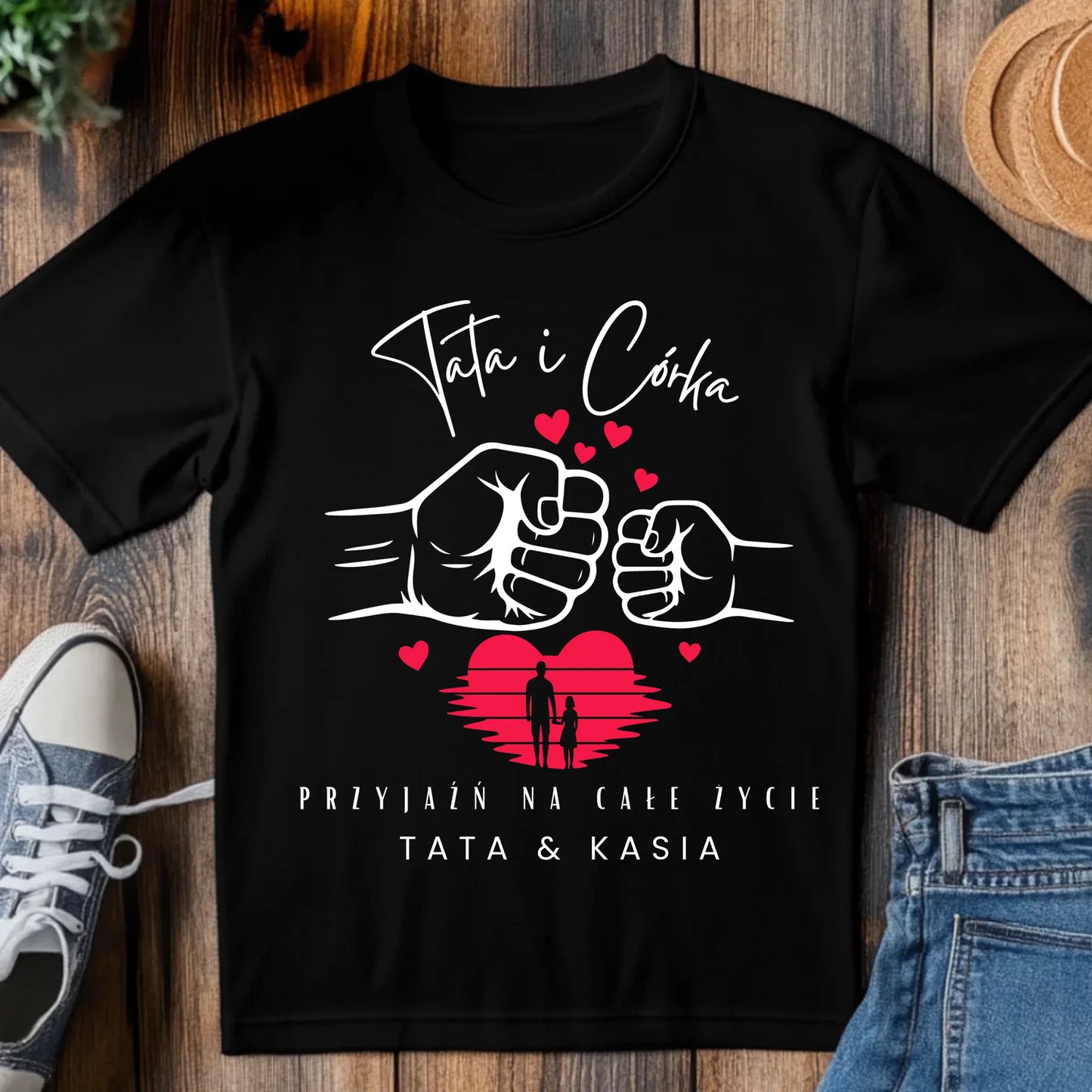 tj_tam_a_black_t-shirt_mockup_on_a_wood_table_with_a_pair_of_sn_6b5f746f-675d-4c35-ad43-c9b394cca209